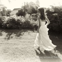 Creative Bridal Session black and white photograph with bride running through her childhood backyard