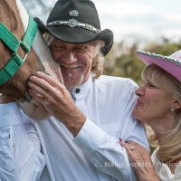 Creative Bridal Session with Bride and Groom in a tender moment with a Clydesdale horse