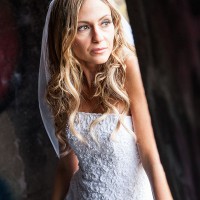 Creative Bridal Session with the Bride in a contemplative pose lit by window light
